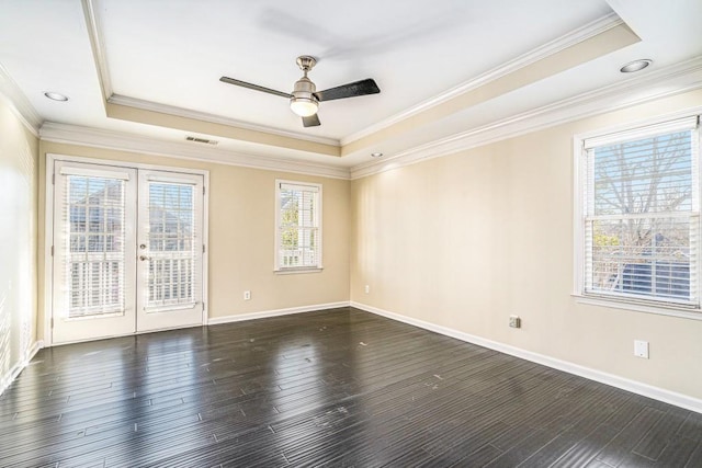 unfurnished room featuring ceiling fan, french doors, and a tray ceiling