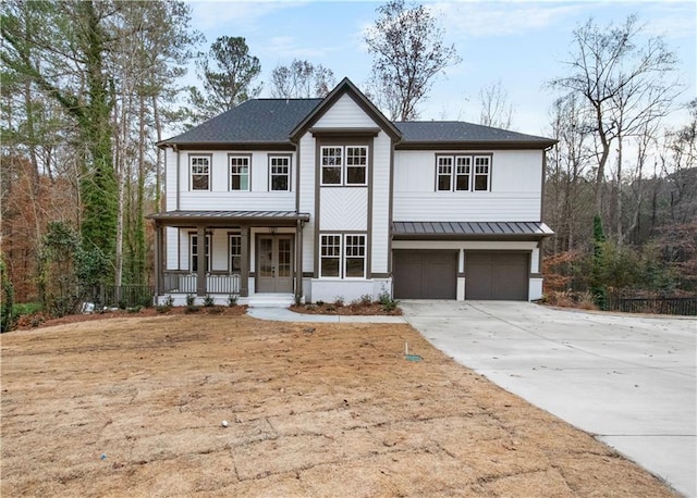 view of front of house featuring a garage and covered porch