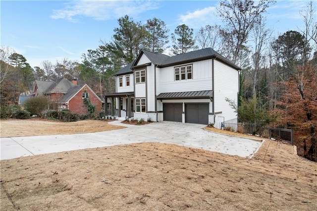 view of front of home with a garage and a porch