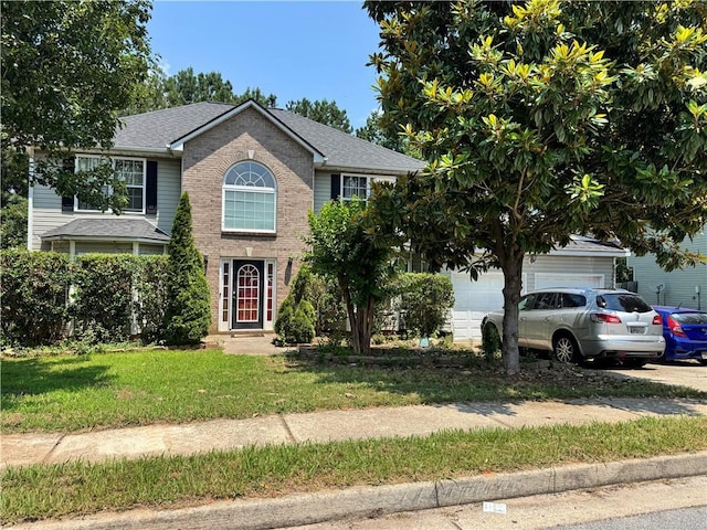 3140 Ridge Hill Pkwy, Douglasville, GA 30135 - view of front of house featuring a front lawn, brick siding, a garage, and roof with shingles