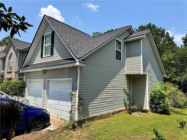 3140 Ridge Hill Pkwy, Douglasville, GA 30135 - view of property exterior with a shingled roof, a yard, and a garage