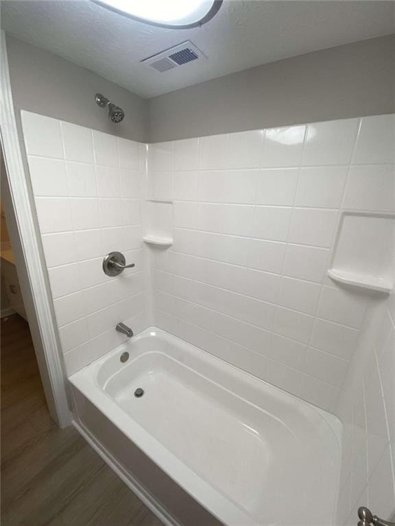 bathroom with  shower combination and wood-type flooring