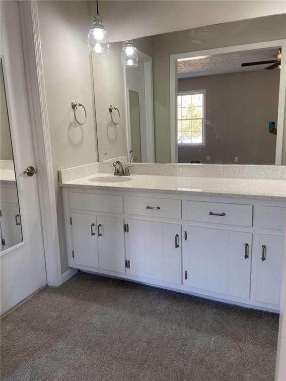 bathroom featuring vanity and ceiling fan