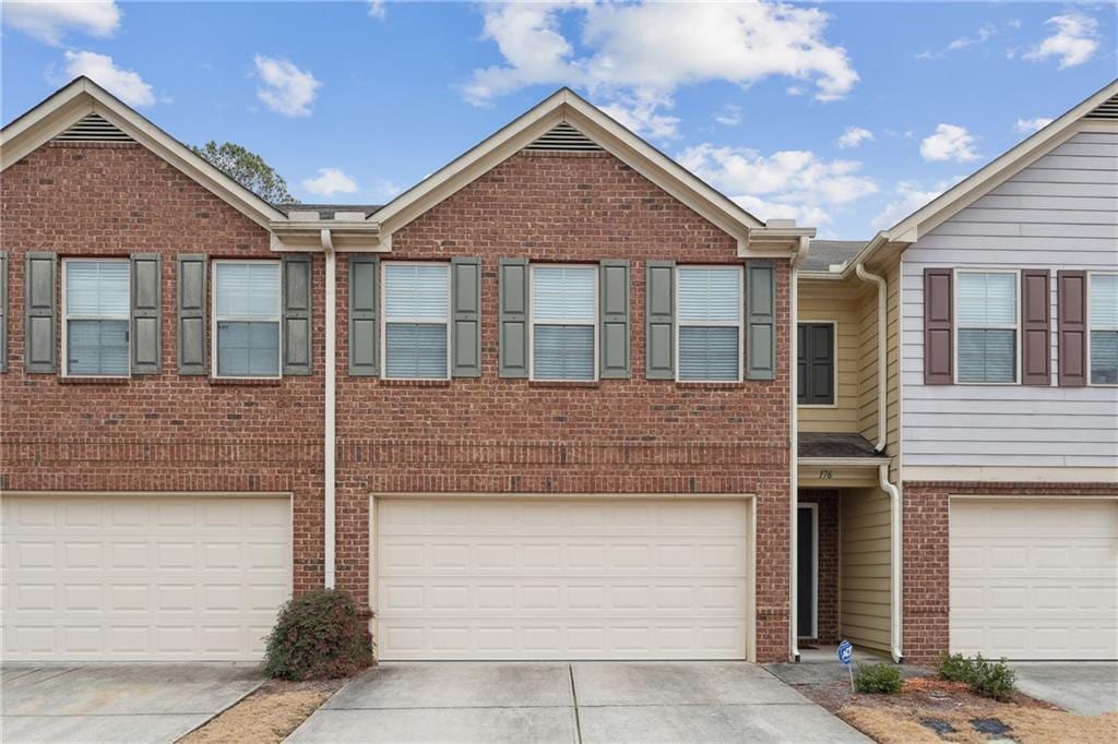 townhome / multi-family property with a garage