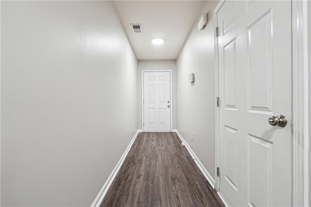 hall with dark wood-type flooring