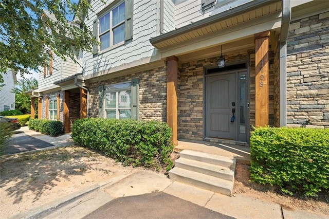 entrance to property with stone siding