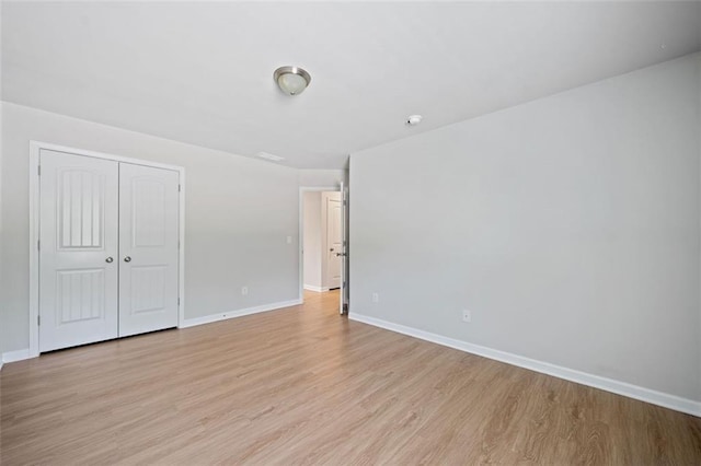 interior space with light wood-type flooring and baseboards