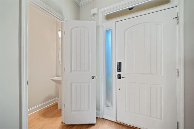 entrance foyer featuring baseboards and light wood-style flooring