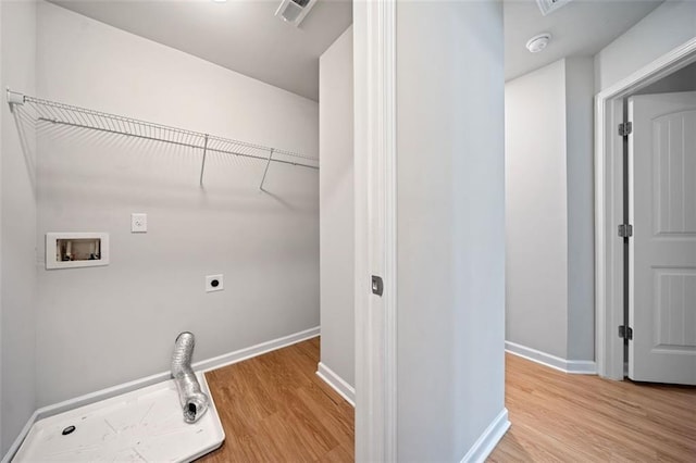 laundry room with light wood-type flooring, visible vents, hookup for an electric dryer, and hookup for a washing machine