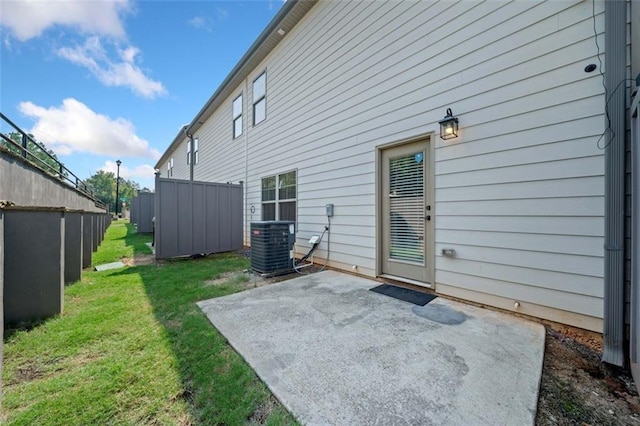 back of house with a yard, a patio area, fence, and cooling unit