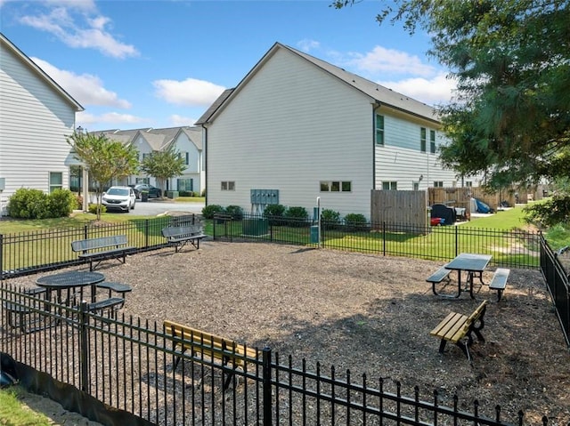 exterior space with a lawn and fence