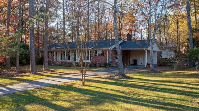 single story home with a front yard and a carport