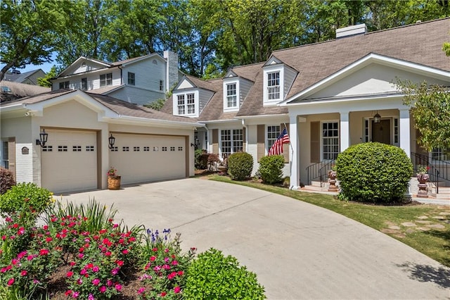 998 Ferncliff Rd NE, Atlanta, GA 30324 - view of front of home with a garage, a chimney, concrete driveway, covered porch, and a shingled roof