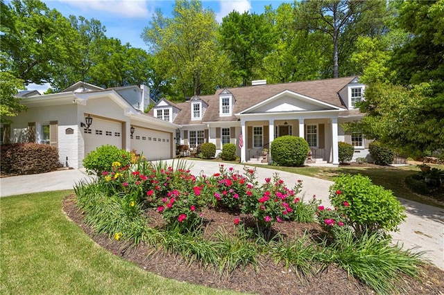 998 Ferncliff Rd NE, Atlanta, GA 30324 - view of front facade with an attached garage, concrete driveway, a porch, and a front yard