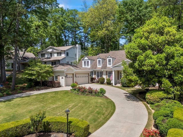 998 Ferncliff Rd NE, Atlanta, GA 30324 - view of front of home with concrete driveway, a front lawn, and a chimney