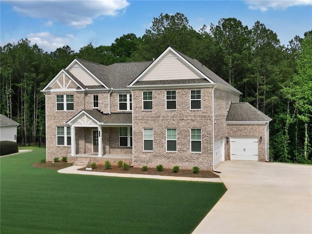 297 Delta Dr, Mcdonough, GA 30252 - craftsman house featuring covered porch, a garage, a front lawn, concrete driveway, and brick siding