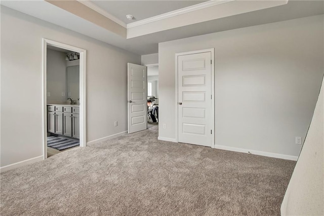 297 Delta Dr, Mcdonough, GA 30252 - unfurnished bedroom featuring carpet, crown molding, baseboards, a sink, and connected bathroom