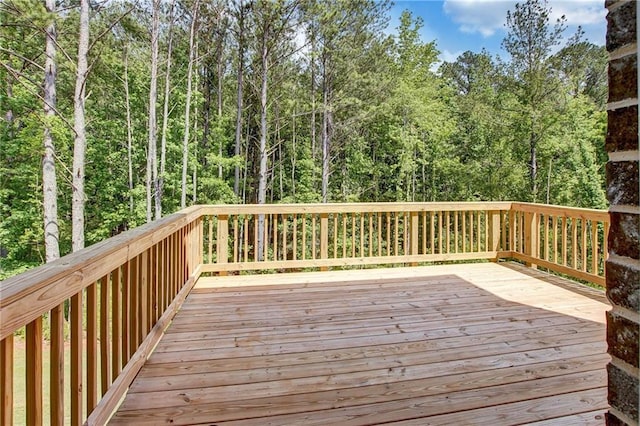 297 Delta Dr, Mcdonough, GA 30252 - wooden terrace with a view of trees