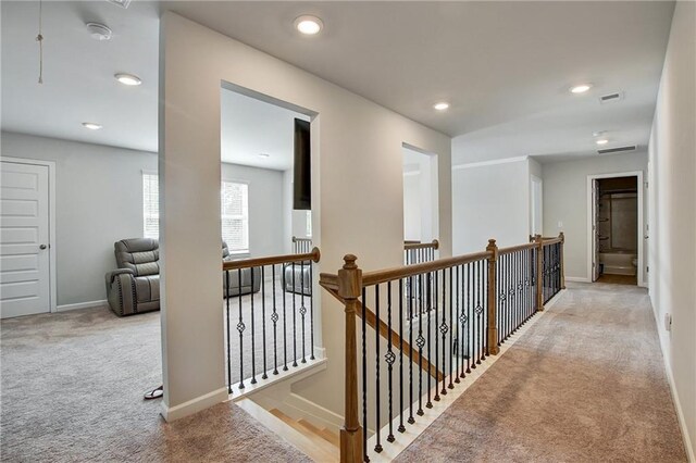 297 Delta Dr, Mcdonough, GA 30252 - corridor with carpet floors, baseboards, an upstairs landing, and recessed lighting
