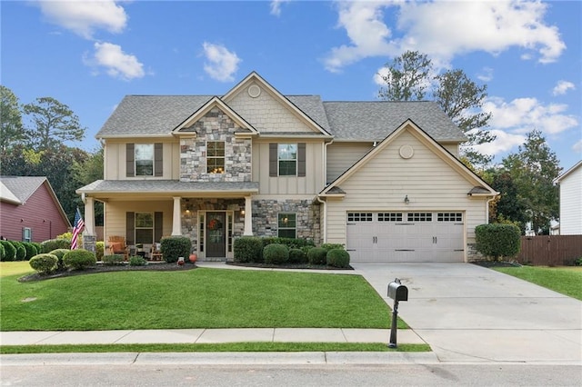 craftsman inspired home with a porch and a front lawn