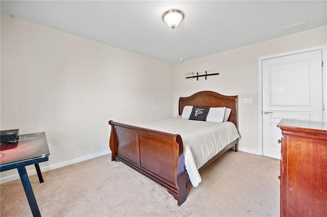 carpeted bedroom with visible vents and baseboards