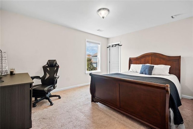 bedroom with light carpet, visible vents, and baseboards