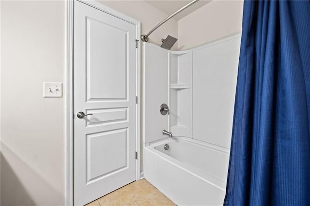full bathroom featuring shower / bath combo with shower curtain and tile patterned flooring