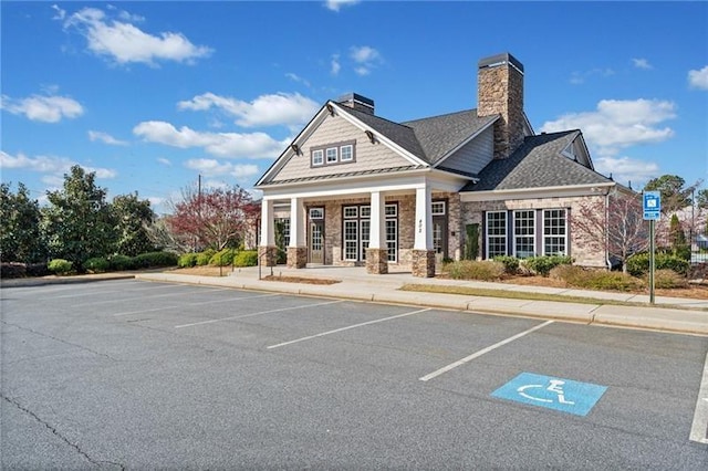 view of property featuring uncovered parking