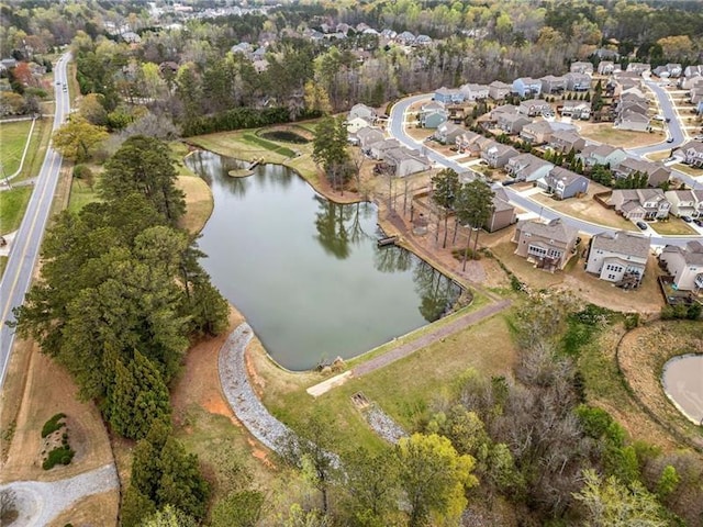 bird's eye view with a residential view and a water view