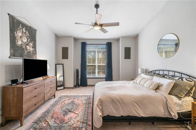 407 The Crossings Ln, Woodstock, GA 30189 - bedroom with baseboards, ceiling fan, and light colored carpet