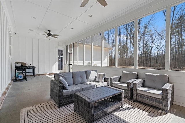 sunroom featuring a wealth of natural light and ceiling fan