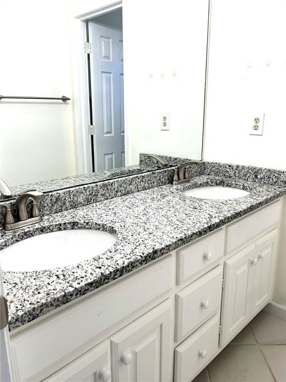 bathroom with vanity and tile patterned floors