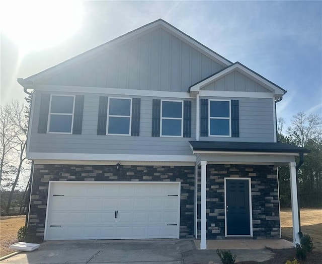 607 W Vincent Dr, Athens, GA 30607 - craftsman-style house featuring stone siding, an attached garage, concrete driveway, and board and batten siding