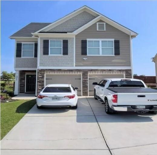 view of front of home featuring a garage and concrete driveway