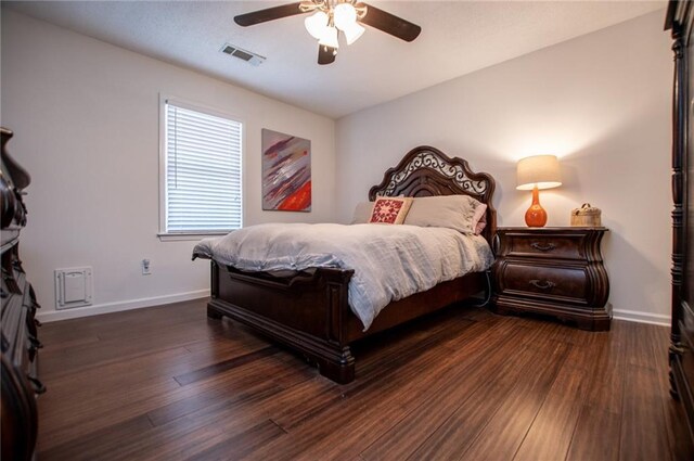 bedroom featuring dark hardwood / wood-style floors and ceiling fan