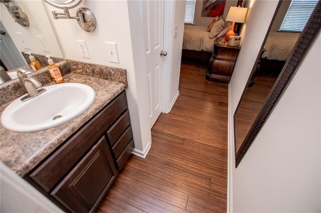 bathroom featuring vanity and hardwood / wood-style flooring