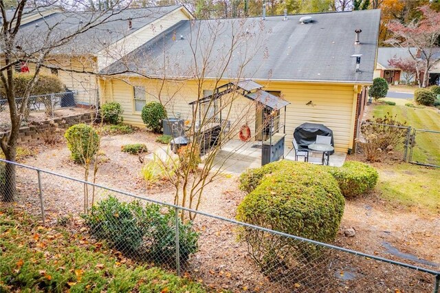 back of property with a patio