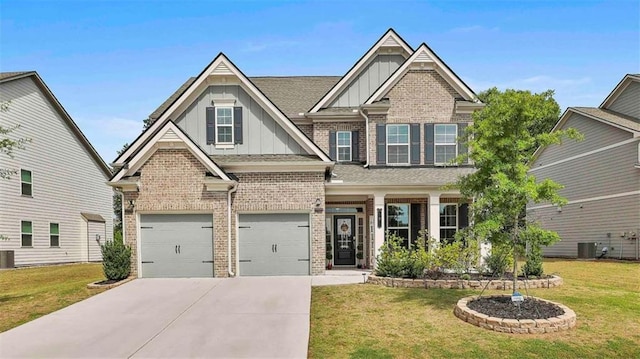 8 Unbridled Way, Newnan, GA 30263 - craftsman-style home with board and batten siding, brick siding, concrete driveway, an attached garage, and a front lawn