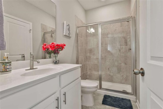 8 Unbridled Way, Newnan, GA 30263 - bathroom with toilet, vanity, a shower stall, and tile patterned floors