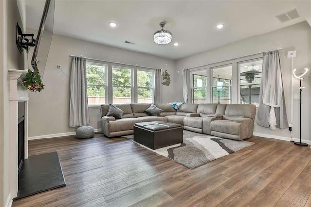 8 Unbridled Way, Newnan, GA 30263 - living room featuring wood finished floors, baseboards, a fireplace, and recessed lighting