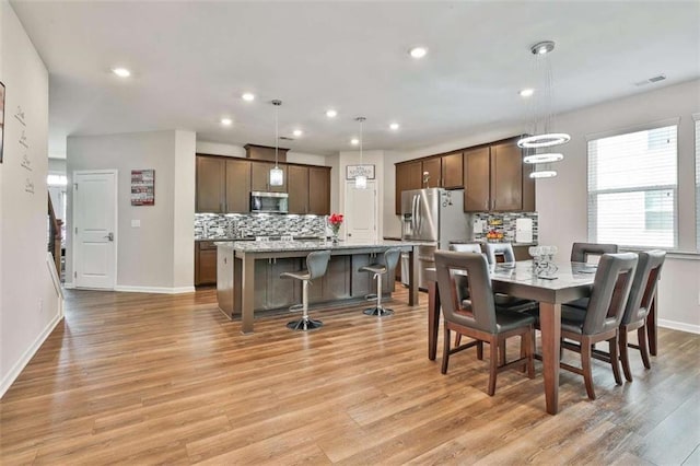 8 Unbridled Way, Newnan, GA 30263 - dining area featuring light wood finished floors, recessed lighting, and baseboards