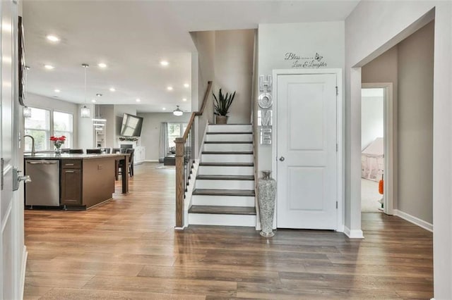 8 Unbridled Way, Newnan, GA 30263 - foyer entrance featuring plenty of natural light, stairs, wood finished floors, baseboards, and recessed lighting