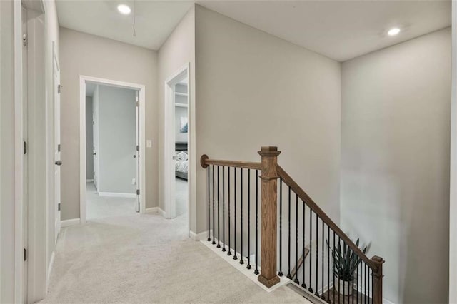 8 Unbridled Way, Newnan, GA 30263 - hallway featuring an upstairs landing, carpet flooring, baseboards, and recessed lighting