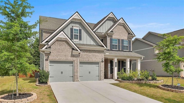 8 Unbridled Way, Newnan, GA 30263 - craftsman-style home featuring board and batten siding, brick siding, a garage, a front yard, and driveway