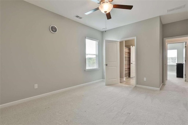8 Unbridled Way, Newnan, GA 30263 - unfurnished bedroom with light carpet, baseboards, and ceiling fan