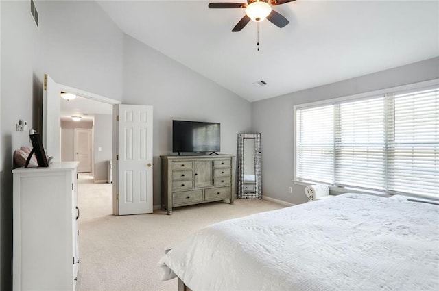 bedroom featuring baseboards, visible vents, ceiling fan, high vaulted ceiling, and light colored carpet