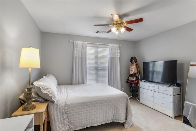 carpeted bedroom featuring visible vents and ceiling fan