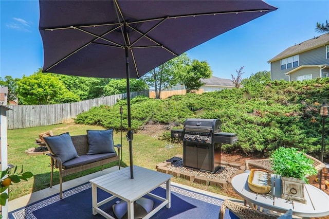 view of patio / terrace with a fenced backyard, outdoor lounge area, and a grill