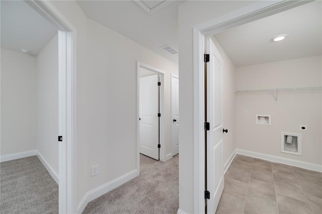 laundry room with hookup for a washing machine, light carpet, and electric dryer hookup