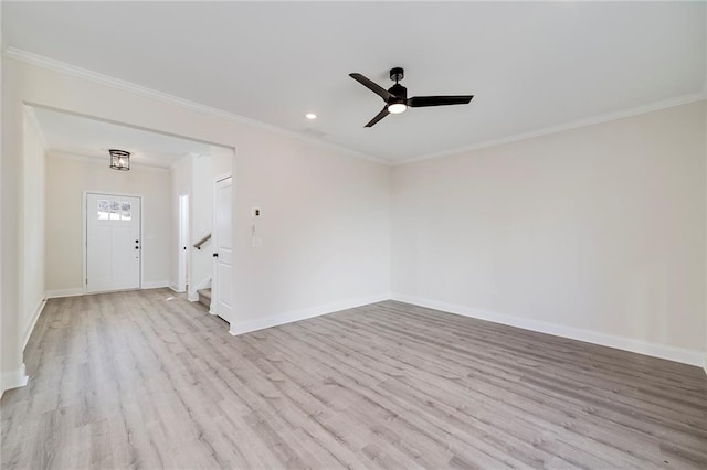 empty room with ceiling fan, light hardwood / wood-style flooring, and ornamental molding